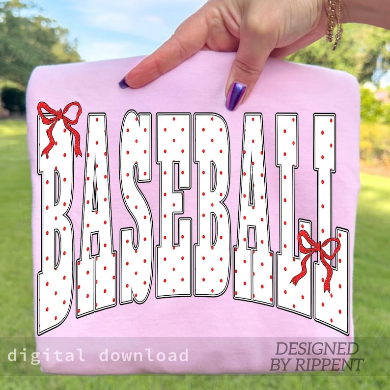 May include: A light pink sweatshirt with the word "BASEBALL" in large white letters with red polka dots. Red bows accent the top and bottom of the word. The words "digital download" and "DESIGNED BY RIPPENT" are at the bottom.