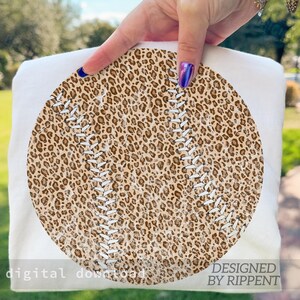 May include: A white baseball-themed design featuring a leopard print baseball with white stitching. The words "digital download" and "designed by Rippent" are printed on the bottom of the design.