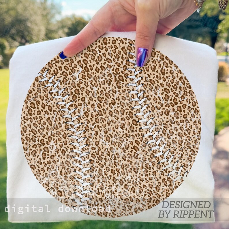May include: A white baseball-themed design featuring a leopard print baseball with white stitching. The words "digital download" and "designed by Rippent" are printed on the bottom of the design.