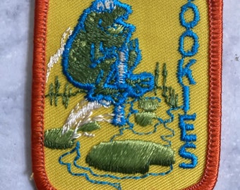 Girl Scout Cookies '82 Frog Pogo Stick Patch Orange Border Yellow 2x2-15/16in