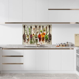a kitchen with white cabinets and white counter tops
