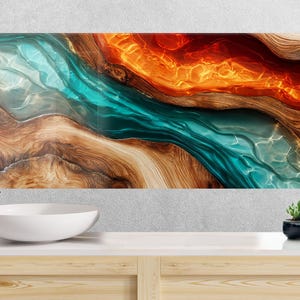 Puede incluir: Arte mural abstracto con un diseño fluido en tonos turquesa, naranja y marrón. La obra de arte se asemeja a un río o paisaje con texturas de vetas de madera. La imagen se muestra sobre un lavabo y un grifo blancos en un baño.