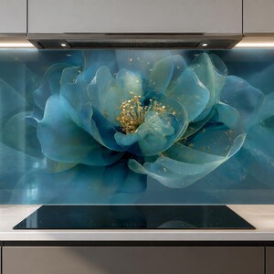 May include: A kitchen backsplash panel featuring a large, abstract blue flower with translucent, layered petals and a central cluster of gold-toned stamens. The design is set against a deep teal background with soft, flowing, smoky wisps.