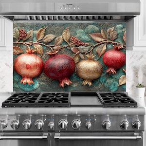 May include: A decorative kitchen backsplash featuring a 3D relief of pomegranates and foliage in shades of red, gold, and teal. The design includes four pomegranates and detailed leaves.