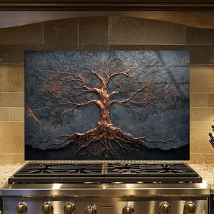 May include: A copper-colored tree sculpture with intricate branches and roots is mounted on a dark gray, textured background. The artwork is displayed above a stainless steel gas stove in a kitchen setting.