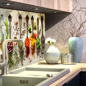 a kitchen with a sink and a bunch of spoons hanging on the wall