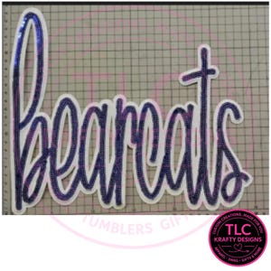 May include: A decorative patch featuring the word Bearcats in a cursive script font. The letters are filled with small, shimmering purple and blue sequins and are outlined with a thick white border, creating a distinct contrast against the background.