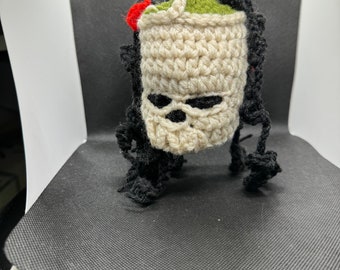 Hanging knit skull and rose plant