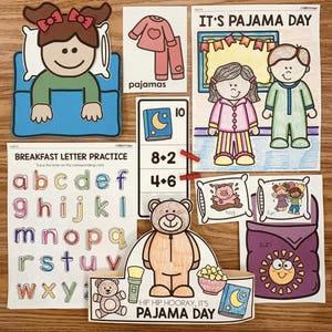 May include: A printable set of educational activities for kids featuring a pajama day theme. The set includes a letter tracing worksheet, a math worksheet, a coloring page of a girl and boy in pajamas, and a cut-out of a teddy bear wearing pajamas. The text "It's Pajama Day" is featured on one of the pages.