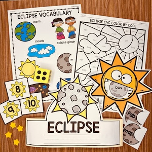 May include: A printable set of educational materials for teaching about eclipses. The set includes a vocabulary sheet with the words "earth", "clouds", and "eclipse glass", a color-by-code activity sheet with the words "hot", "ten", "leg", "lot", "bet", "dog", "mop", "pep", "pet", "jet", "hut", "log", "cot", "beg", "run", "bug", "pop", "vet", "yes", "pof", "net", "pin", "bag", "hit", "in", "bus", and "son", and a crown-shaped cut-out with the word "ECLIPSE" on it.