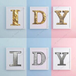 May include: Three white picture frames with gold and silver letters spelling out "I D Y". The frames are on a blue and pink background.