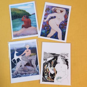 May include: Set of four art prints featuring colorful illustrations of women in various poses. The prints are on white cardstock and have a white border.