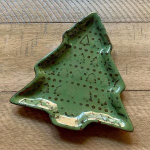 May include: A rustic wooden sign with the text "Welcome to our home" in white lettering. The sign features a distressed finish and a simple, inviting design, perfect for entryway decor.