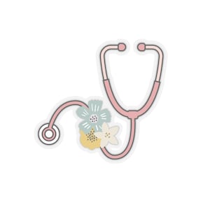 Puede incluir: Estetoscopio rosa con un diseño floral con flores azules, amarillas y blancas.
