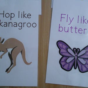 May include: Two white cards with text and illustrations. One says "Hop like a kanagroo" with a brown kangaroo. The other says "Fly like a butterfly" with a purple butterfly.