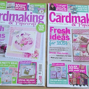 May include: Two copies of "Cardmaking & Papercraft" magazine are shown. The covers display "Fresh ideas" with images of handmade cards. One cover promotes summer card ideas, the other, ideas for 2014. The magazines are from the UK.