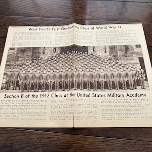 May include: A black and white printed document titled West Point's First Graduating Class of World War II and Section B of the 1942 Class at the United States Military Academy, featuring a large group photograph of cadets in uniform.