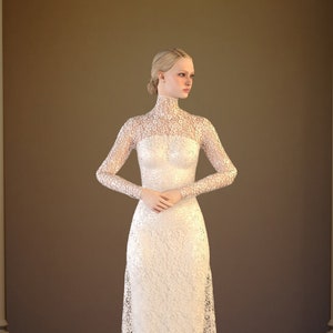 May include: A woman wearing a white lace wedding dress with a high neckline and long sleeves. The dress has a fitted bodice and a flowing skirt.