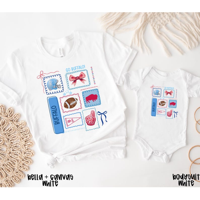 May include: White t-shirts and a onesie with a Buffalo Bills theme. Each garment features a design with a football helmet, a football, a buffalo, and a #1 hand symbol. The text "GO BUFFALO!" and "BUFFALO" are also included.