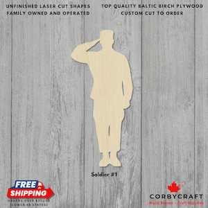 May include: Unfinished laser-cut wooden soldier shape. The figure is saluting and labeled "Soldier #1". The image also includes text that reads "Unfinished Laser Cut Shapes", "Top Quality Baltic Birch Plywood", and "Family Owned and Operated".