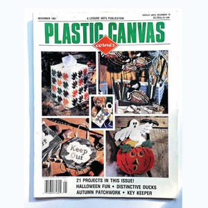 Peut inclure: Un magazine Plastic Canvas Corner de novembre 1991 présentant 21 projets d'artisanat. La couverture montre une boîte à mouchoirs à motifs de feuilles, un organisateur de canards, un fantôme sur une citrouille et un panneau Keep Out.