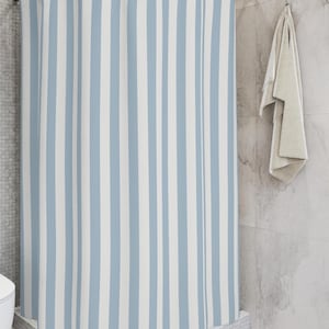 A light blue and white striped shower curtain; minimalist, modern, beachy aesthetic.