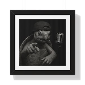 May include: Black and white framed print featuring a turtle wearing a backward baseball cap and pointing. A vintage microphone stands to the right. The turtle has a detailed, textured shell and skin, with a serious expression.