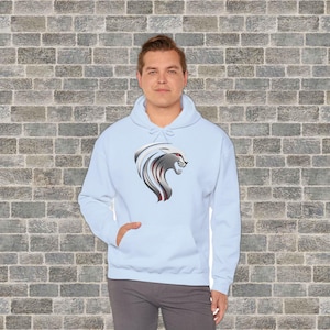 May include: A light blue hooded sweatshirt with a silver and red lion graphic on the front.