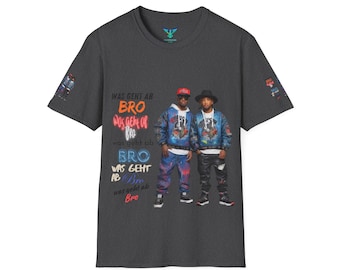May include: A dark grey t-shirt featuring a graphic print of two men wearing colourful jackets and jeans. The text on the shirt reads "WAS GENT AB BRO Was geht of BRO was geht ab BRO WAS GEHT AB Bro was geht ab Bro".