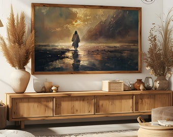May include: A framed painting depicting a lone figure walking on a beach towards a sunset. The painting has a warm color palette with shades of brown, orange, and yellow. The figure is silhouetted against the setting sun, creating a dramatic effect.