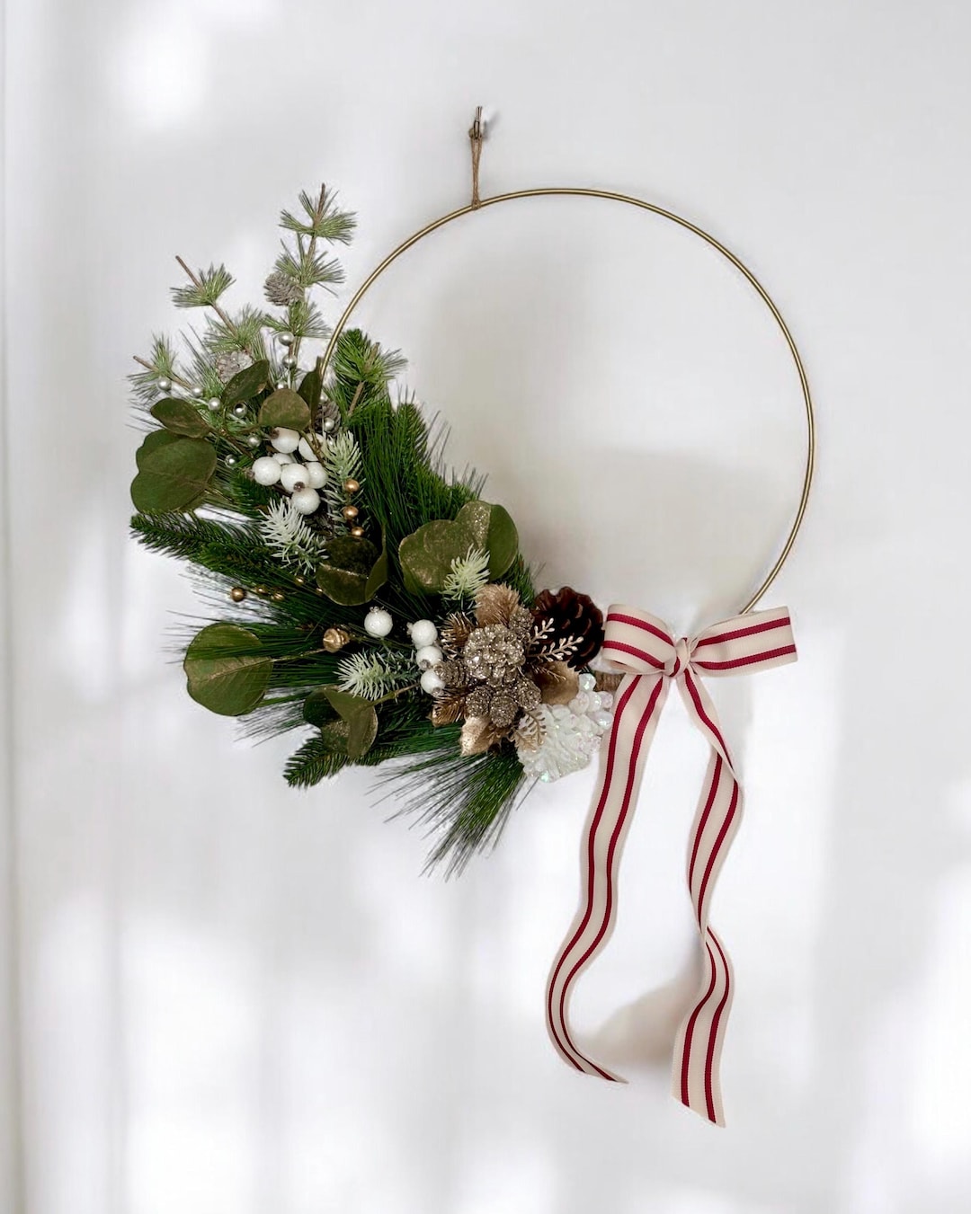 modern-white-and-gold-glittery-eucalyptus-hoop-wreath-frosted-pine-and