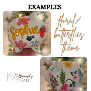 May include: White ceramic piggy bank with custom floral and butterfly designs. One bank features the name "Sophie" in yellow script, with pink flowers and a strawberry. The other bank has a butterfly and various flowers. Text reads "Custom Design Examples".