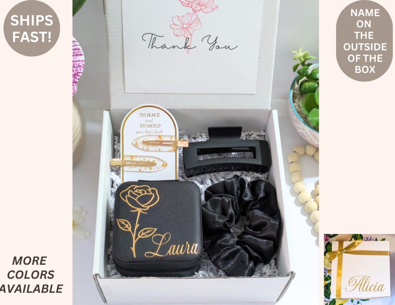 May include: A gift box containing a black jewelry case with a gold rose design and the name "Laura", a black hair clip, two gold hair clips, and a black scrunchie. A card reads "Thank You".