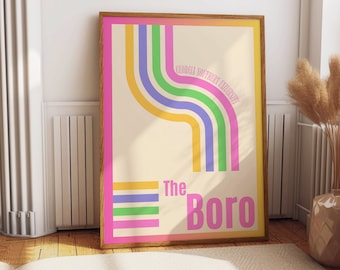 May include: A framed poster with a retro design. The poster features a cream-colored background with colorful curved lines in pink, yellow, blue, and green. The text "GEORGIA SOUTHERN UNIVERSITY" and "The Boro" are also displayed.