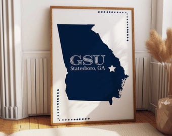 May include: A white print with a blue outline of the state of Georgia. The text "GSU Statesboro, GA" is centered on the state outline with a white star to the right of the text.