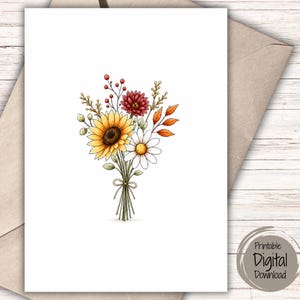 May include: A greeting card featuring a hand-drawn illustration of a floral bouquet with a yellow sunflower, a white daisy, a dark red dahlia, orange autumn leaves, and red berries, all tied together with a simple string bow on a white background.