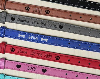 May include: A collection of personalized dog collars in various colors, including black, brown, gray, blue, red, pink, and teal. Each collar features a name and phone number, along with paw prints, hearts, or bone designs.