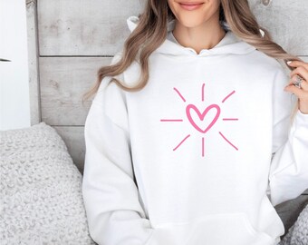 Rosa hjärtformad huvtröja med grafisk design, romantisk present