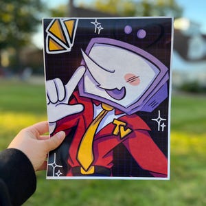 May include: A rectangular art print featuring a cartoon character with a purple television head, a long nose, and a red suit jacket with a yellow tie. The character has a yellow TV logo on the lapel, white gloves, and is set against a dark grid background.