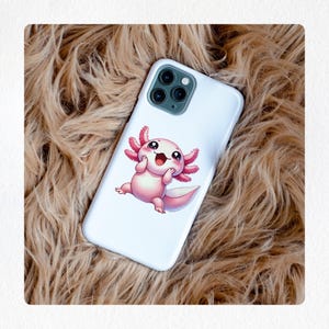 May include: White phone case featuring a cartoon axolotl illustration. The axolotl is pink with large, feathery gills and a happy expression. The case has a glossy finish and is designed for a smartphone.