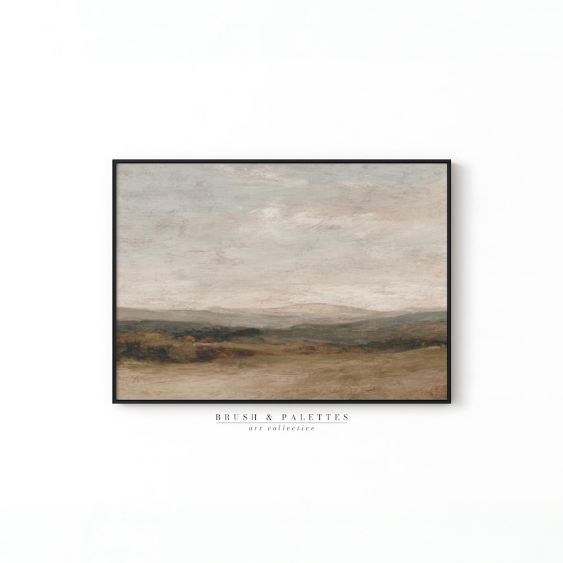May include: An abstract landscape painting in a black frame. The artwork features a muted color palette of beige, brown, and green, depicting rolling hills under a cloudy sky. The text "BRUSH & PALETTES art collective" is at the bottom.