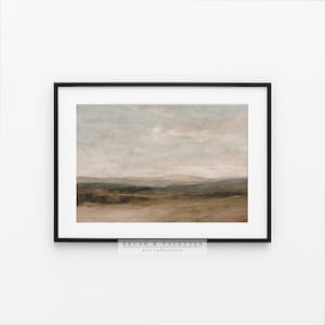 May include: Framed landscape art print featuring a muted color palette of beige, green, and gray. The artwork depicts a serene countryside scene with rolling hills and a cloudy sky. The text "BRUSH & PALETTES art collective" is at the bottom.