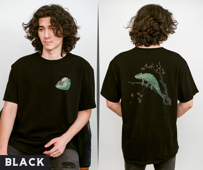 May include: Black t-shirt with a green chameleon graphic on the back and a small green lizard graphic on the front. The t-shirt is made of a soft, comfortable material.