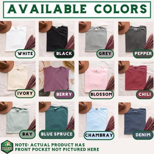 May include: A product display showcasing t-shirts in various colors, including white, black, grey, pepper, ivory, berry, blossom, chili, bay, blue spruce, chambray, and denim. Each shirt is folded and presented with a hat and decorative plant. The text "AVAILABLE COLORS" is at the top.