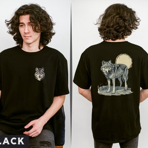 May include: Black t-shirt with a wolf graphic on the front and a wolf and moon graphic on the back.