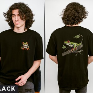 May include: Black t-shirt with a green tree frog graphic on the front and a larger green tree frog graphic on the back. The frog is sitting on a branch with leaves.