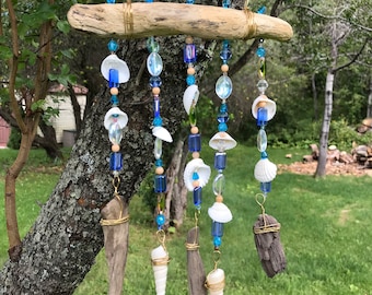 Wind chimes with seashells, glass beads, driftwood and wire