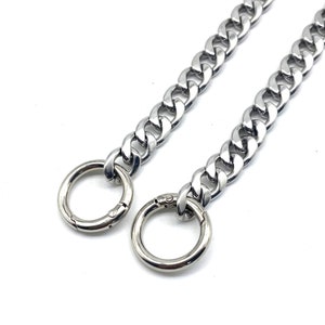 May include: A silver chain with two large, round, silver clasps. The chain is thick and has a curb link design.