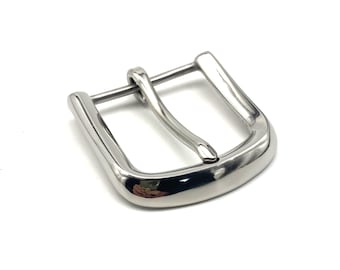 May include: A polished silver belt buckle with a rectangular frame and a curved bar. The buckle is designed for belts and has a shiny finish. The metal buckle is shown against a white background.