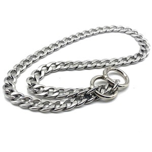 May include: A silver curb chain dog collar with two large, round, silver rings.